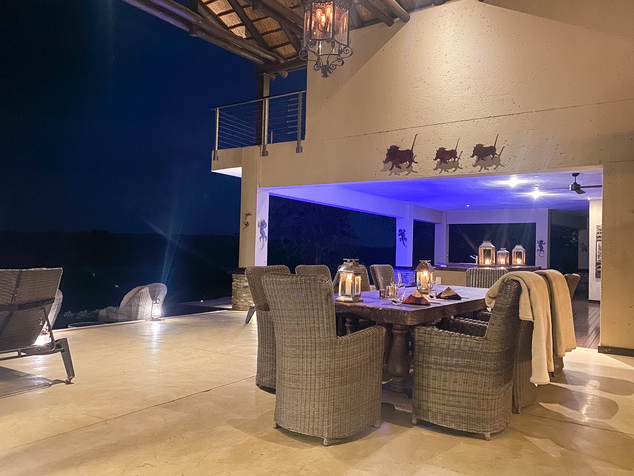 Outdoor patio with dining table under the thatched roof