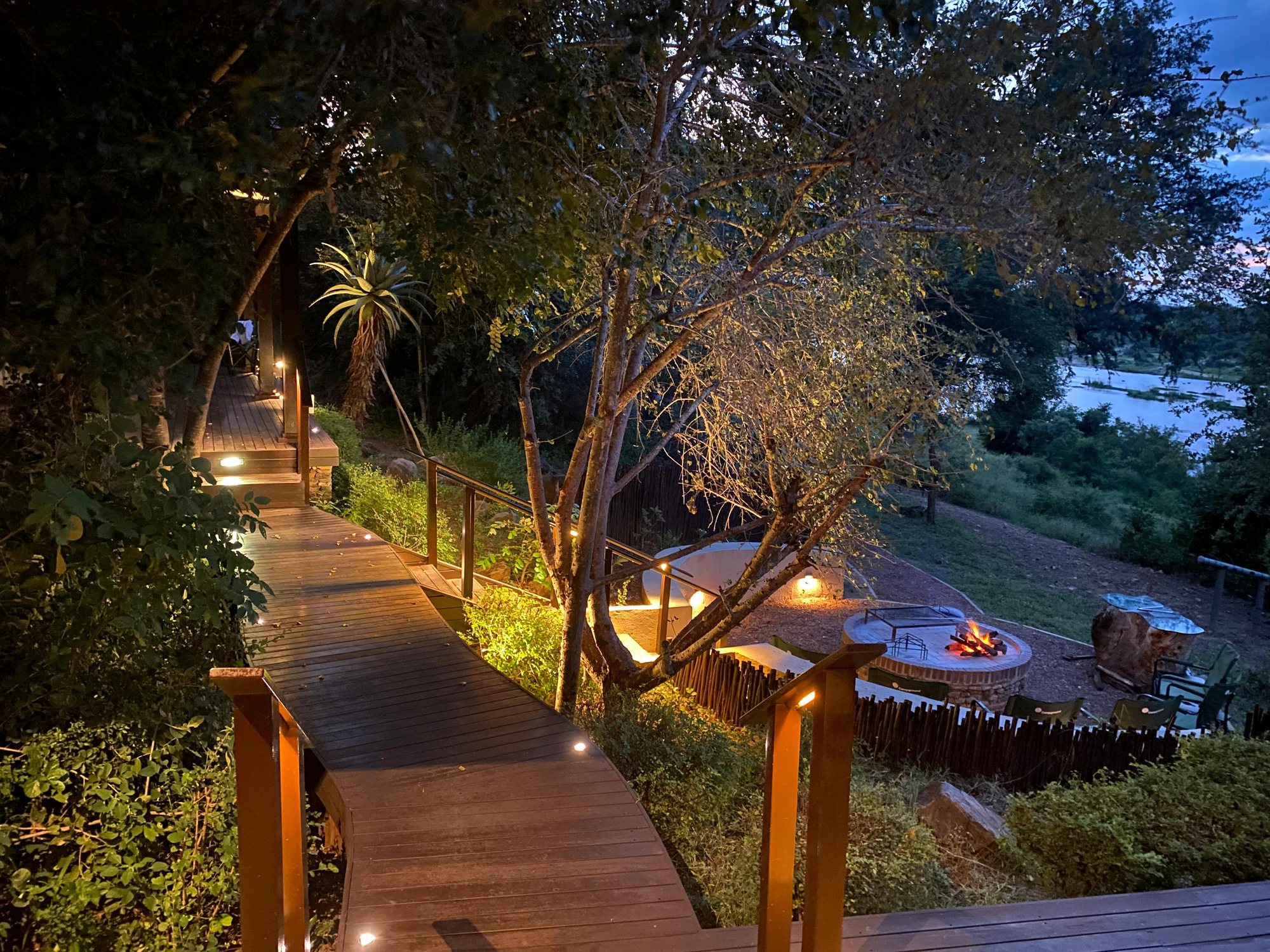 The lit walkway to the lodge at night